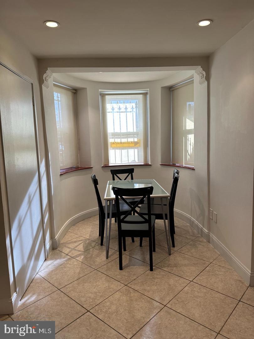 830 D Street Southeast, Unit B Washington, DC 20003 - Photo 11 of 23 a view of a dining room with furniture and a chandelier