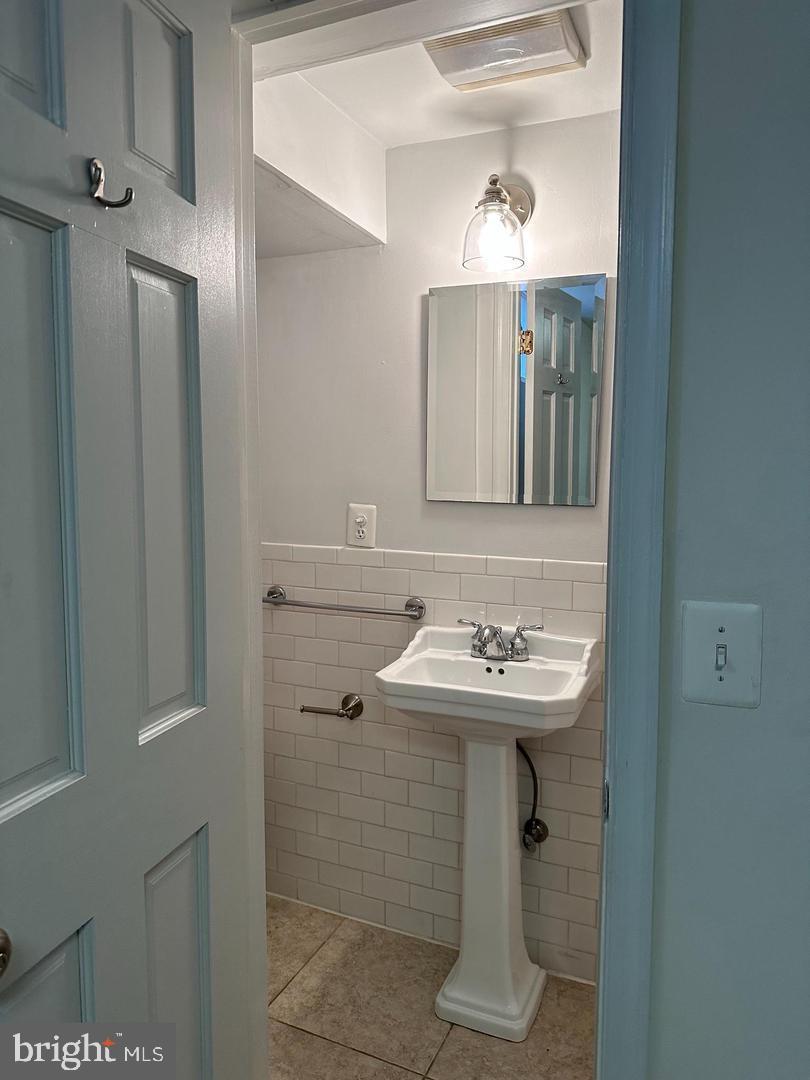 830 D Street Southeast, Unit B Washington, DC 20003 - Photo 20 of 23 a bathroom with a sink and a mirror