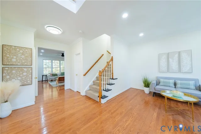 a view of a livingroom with furniture and stairs