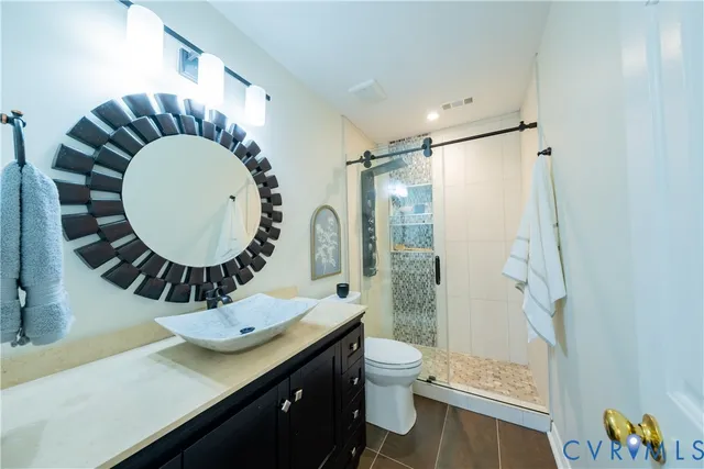 a view of a livingroom with a table and chairs
