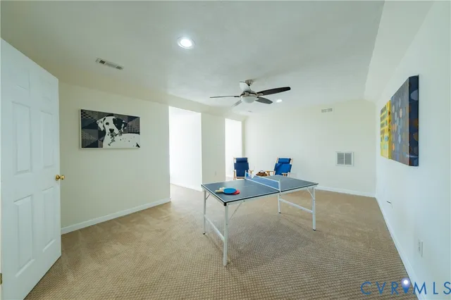 a work room with table and chairs