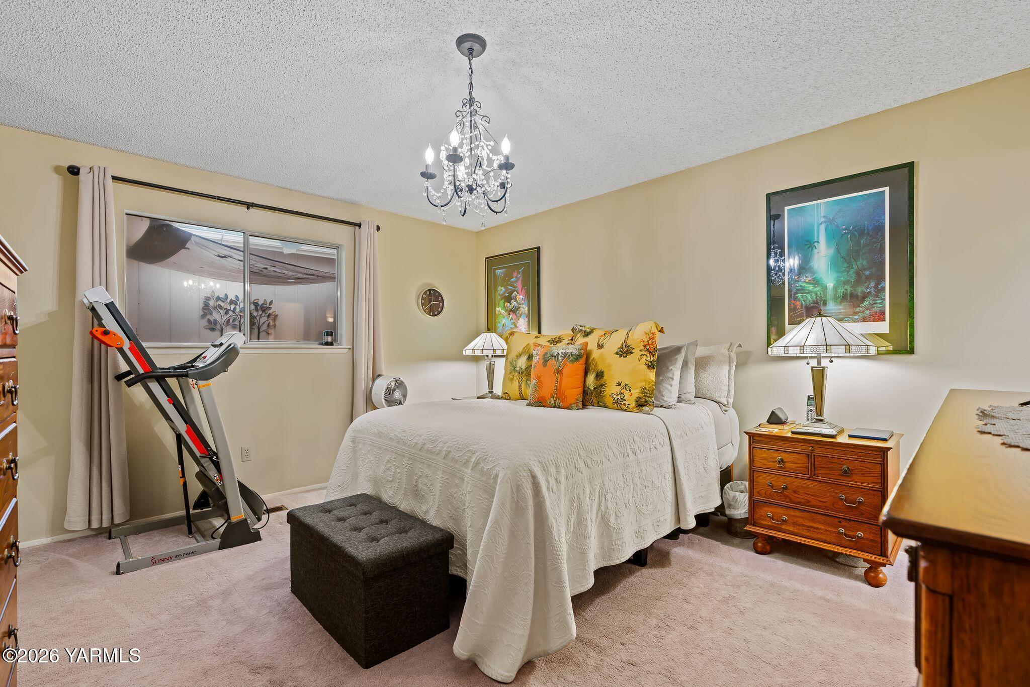 5701 West Chestnut Avenue, Unit 1 Yakima, WA 98908 - Photo 18 of 26 a bedroom with bed and window