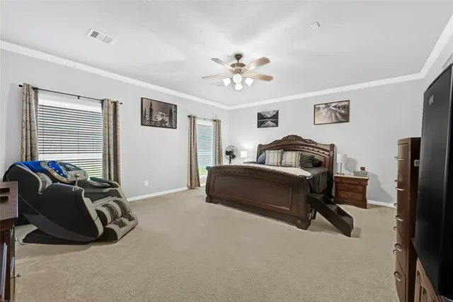 a bedroom with furniture and a window