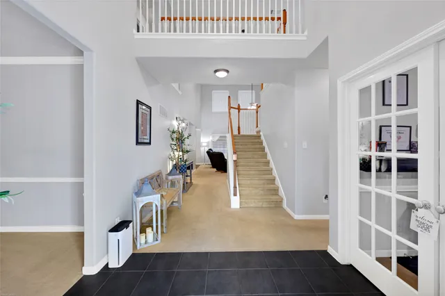 a view of a living room with furniture and wooden floor