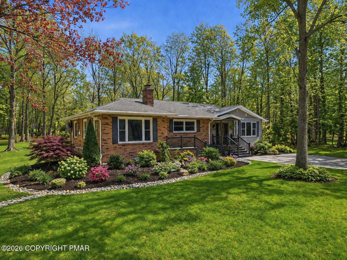 144 Highridge Road Albrightsville, PA 18210 - Photo 6 of 96 a front view of a house with garden