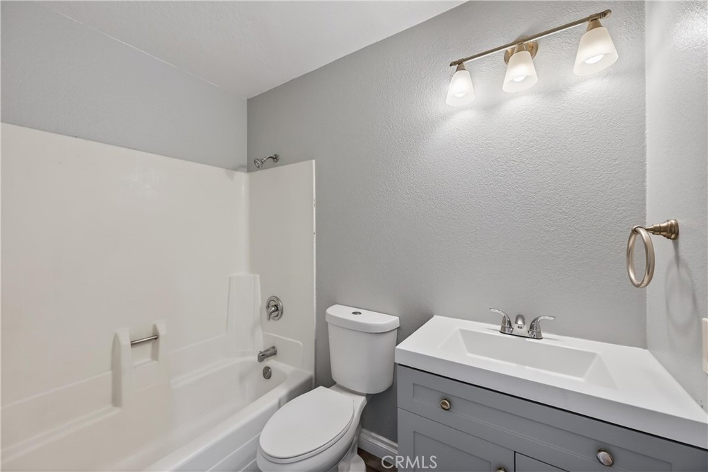 600 Central, Unit 291 Riverside, CA 92507 - Photo 13 of 35 a bathroom with a sink a toilet and shower