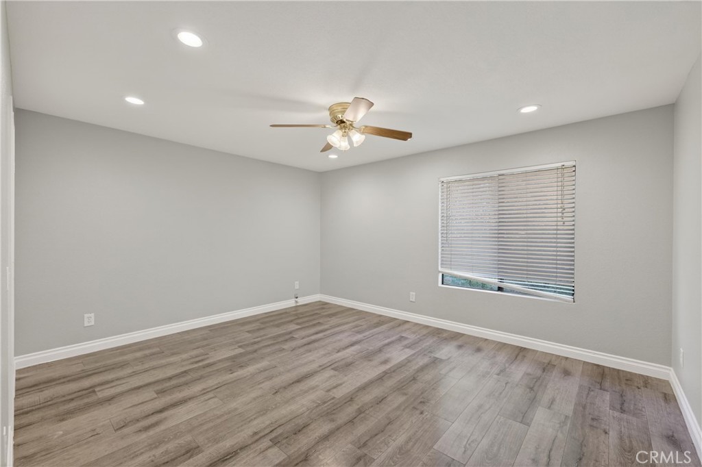 600 Central, Unit 291 Riverside, CA 92507 - Photo 18 of 35 wooden floor in an empty room with a window