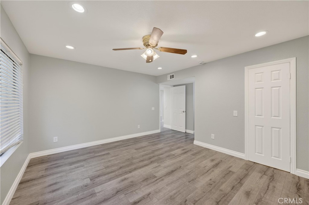 600 Central, Unit 291 Riverside, CA 92507 - Photo 19 of 35 wooden floor in an empty room with a window