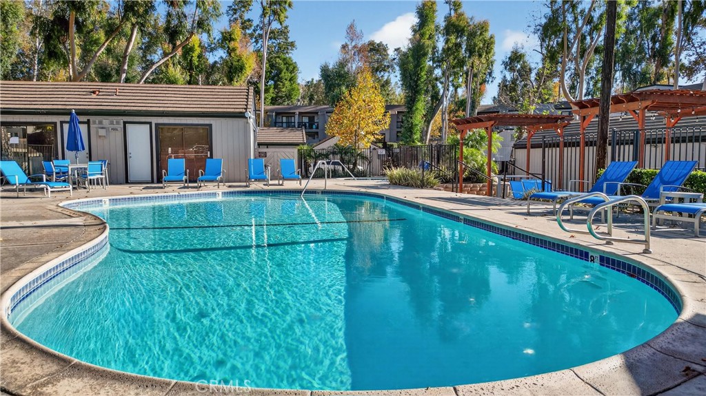 600 Central, Unit 291 Riverside, CA 92507 - Photo 25 of 35 a view of a house with pool and chairs