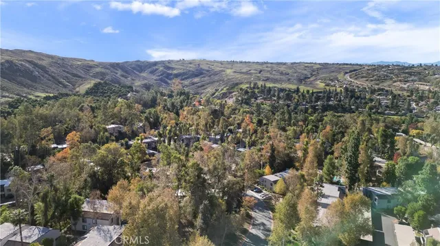 an aerial view of residential house and green space