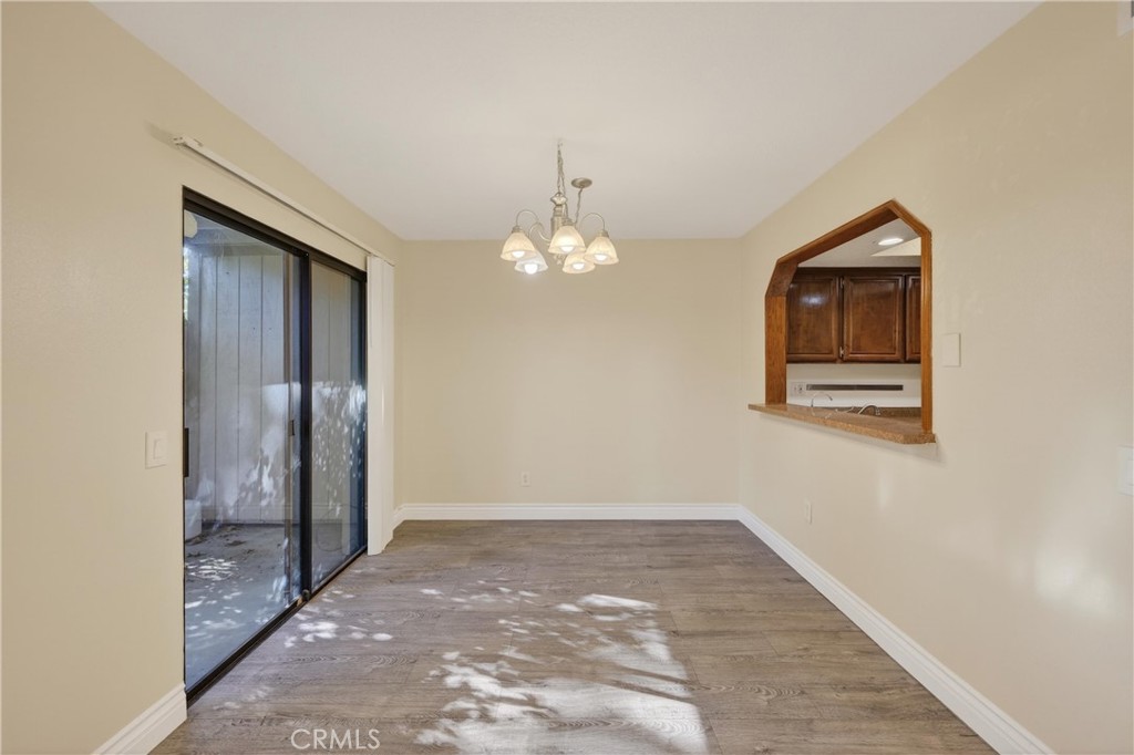 600 Central, Unit 291 Riverside, CA 92507 - Photo 6 of 35 a view of a livingroom with wooden floor