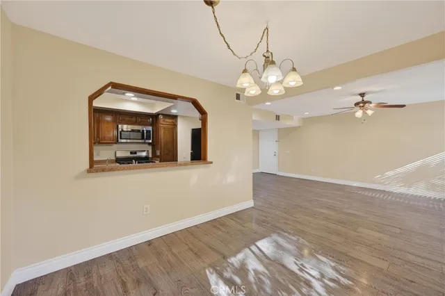 a view of a room with wooden floor