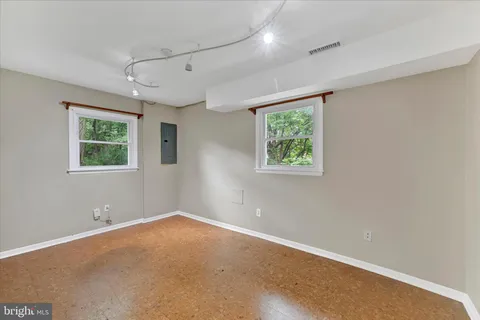 a view of room with window and ceiling fan