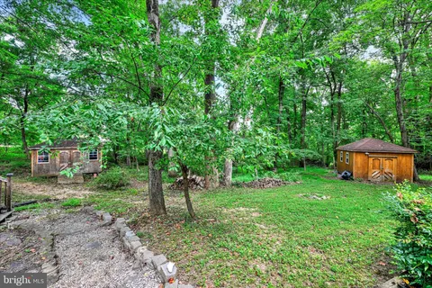 a backyard of a house with lots of green space