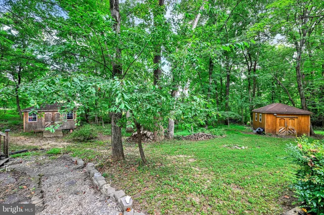 a backyard of a house with lots of green space