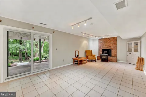 a view of a livingroom with furniture and a fireplace