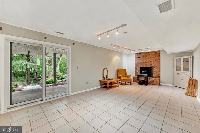 a view of a livingroom with furniture and a fireplace