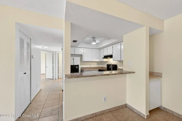 a kitchen with a sink stove and refrigerator