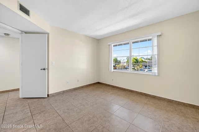 a bathroom with a granite countertop sink mirror and shower