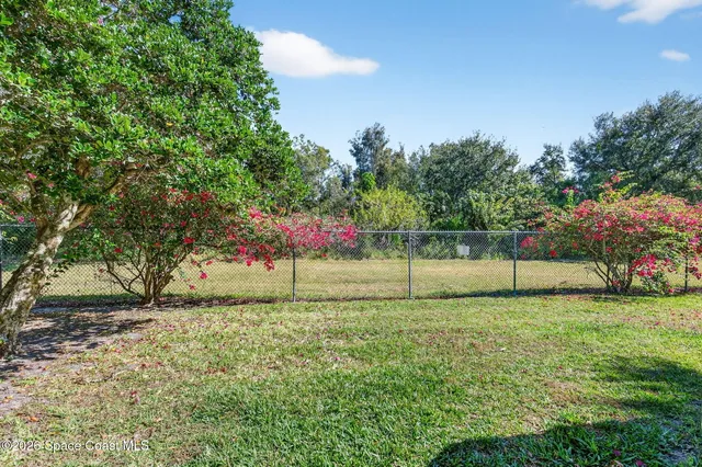 a dining hall with lots of tables and chairs