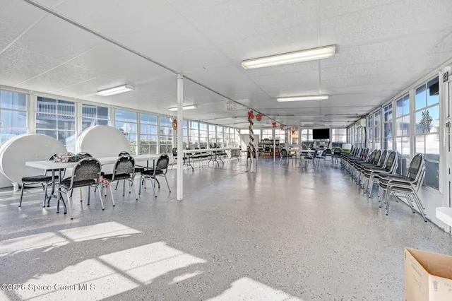 a view of house with outdoor space and swimming pool