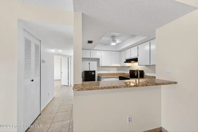 a kitchen with a refrigerator a sink and dishwasher