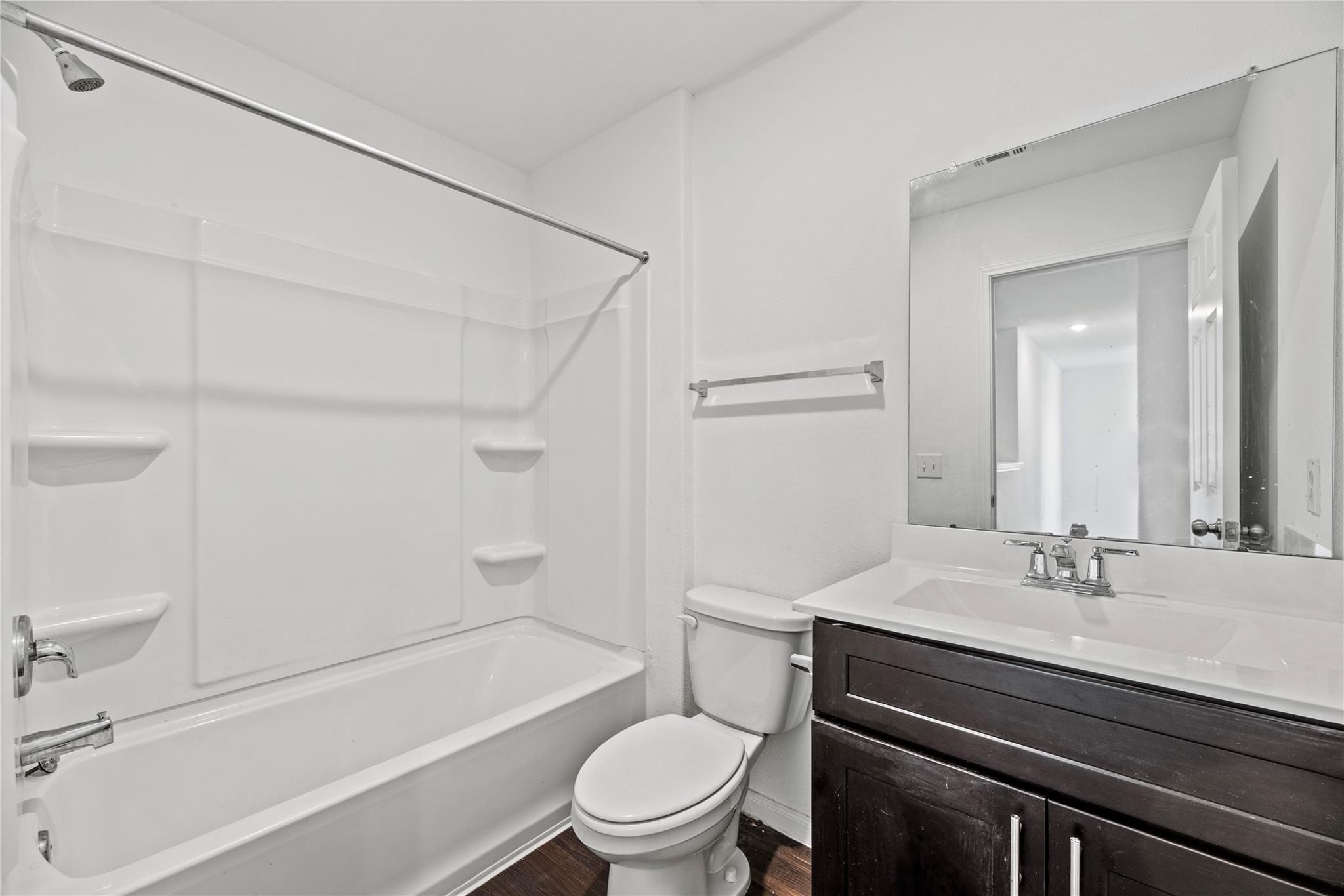 7322 Madison Cmns Lane Houston, TX 77075 - Photo 12 of 14 a bathroom with a sink a toilet and a bathtub