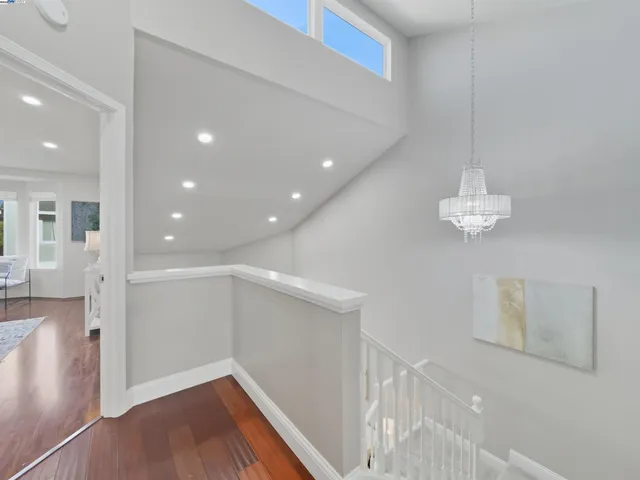 a bedroom with a bed and a potted plant