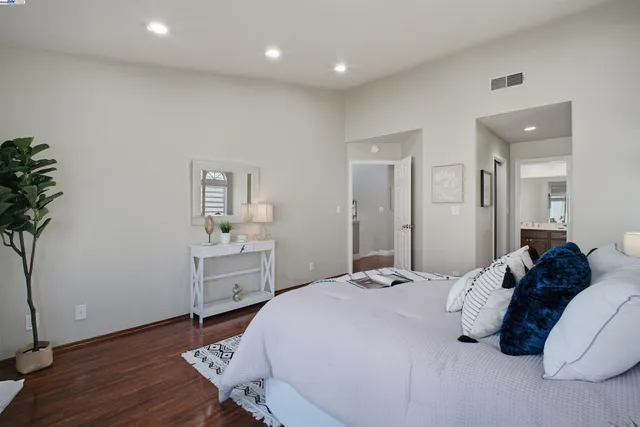 a spacious bathroom with a double vanity sink a mirror and shower