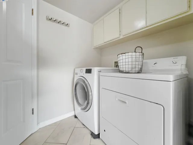 a very nice looking room with wooden floor and a bathroom