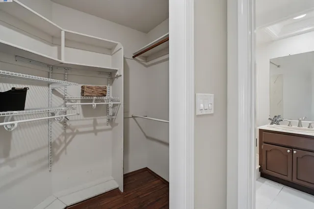 a living room with a bed furniture and a window