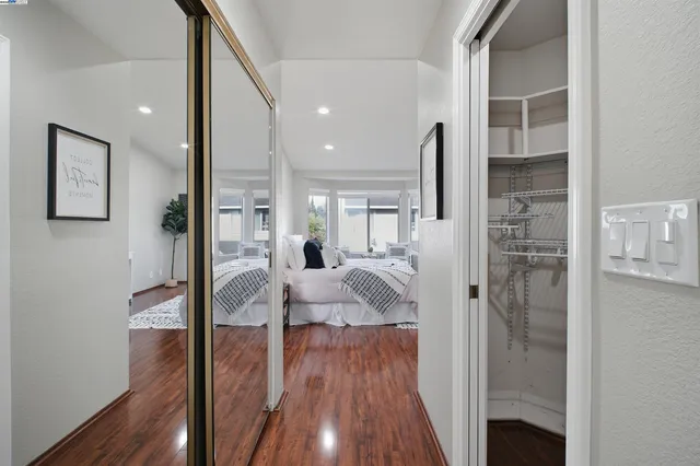 a bedroom with a bed and a table