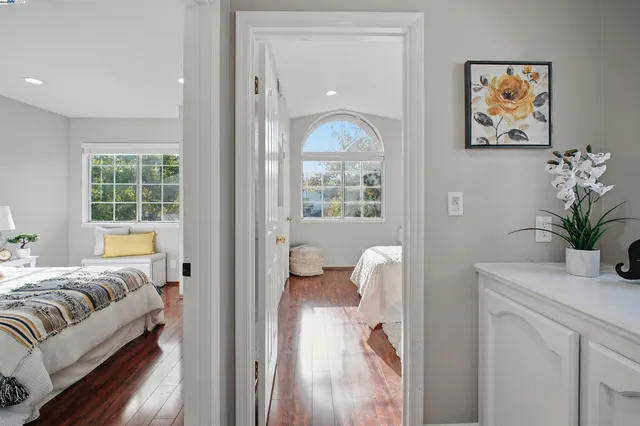a bedroom with a bed and a lamp on table