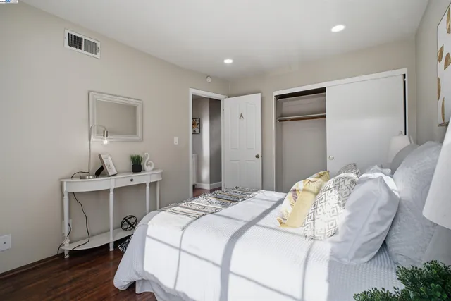 a view of a patio with a dining table and chairs with a fire pit and a yard