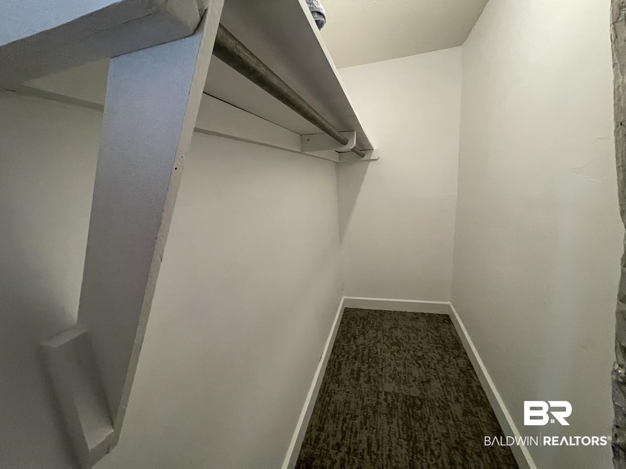 6621 Purvis Road Daphne, AL 36527 - Photo 41 of 59 Walk in closet with dark colored carpet