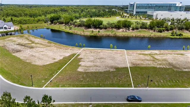 an aerial view of a residential houses with outdoor space