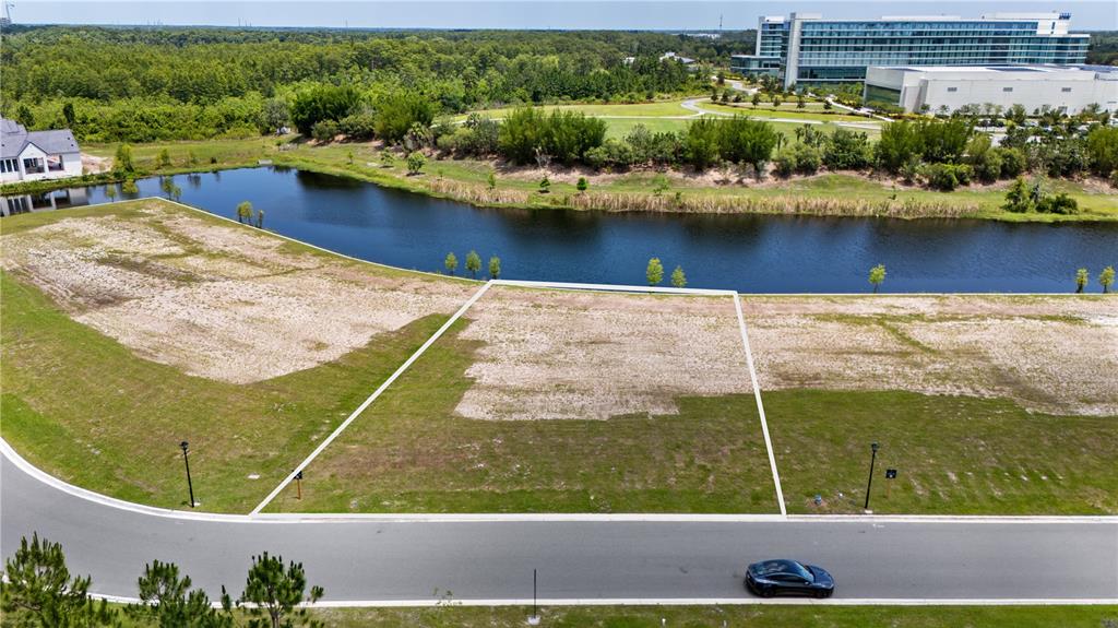 an aerial view of a residential houses with outdoor space