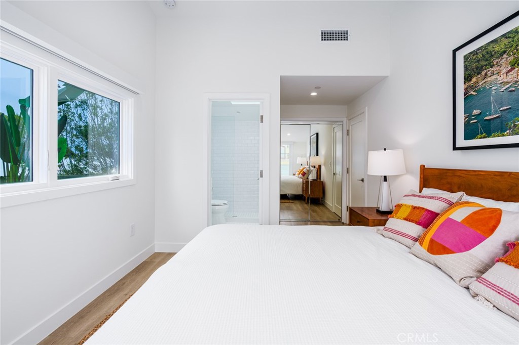 476 Morning Canyon Road Corona del Mar, CA 92625 - Photo 11 of 22 a bedroom with a bed and window