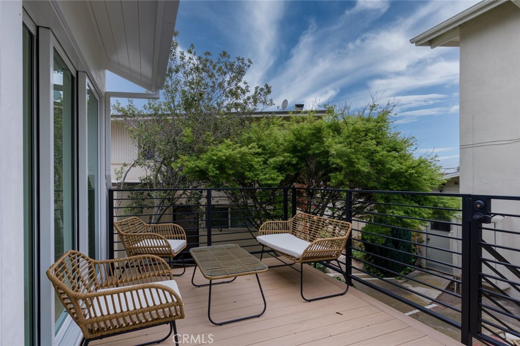 476 Morning Canyon Road Corona del Mar, CA 92625 - Photo 20 of 22 a view of a chairs and tables in the balcony