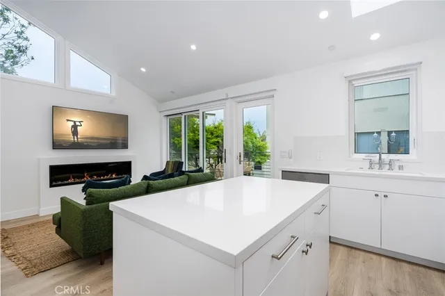 a kitchen with a stove a sink and a microwave