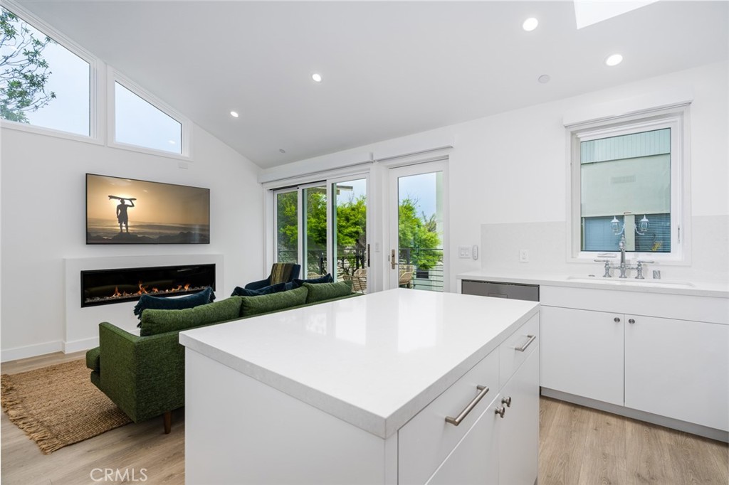476 Morning Canyon Road Corona del Mar, CA 92625 - Photo 6 of 22 a kitchen with a stove a sink and a microwave
