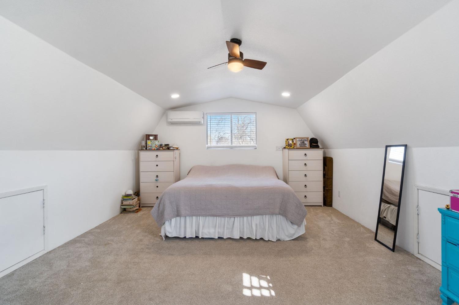 29696 Auberry Road Prather, CA 93651 - Photo 18 of 34 a bedroom with a bed and a large mirror