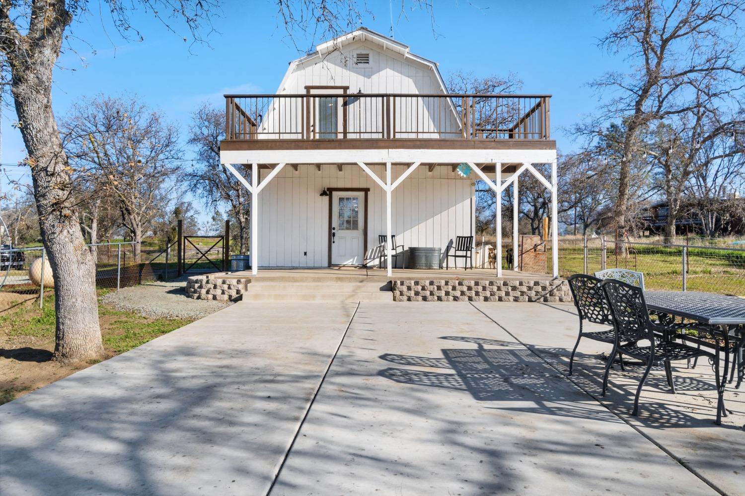 29696 Auberry Road Prather, CA 93651 - Photo 2 of 34 a front view of a house with swimming pool