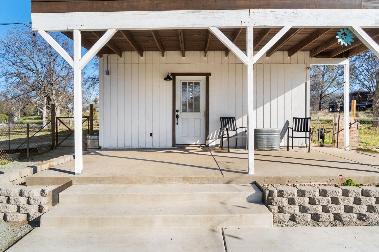 29696 Auberry Road Prather, CA 93651 - Photo 6 of 34 a front view of a house with a outdoor space