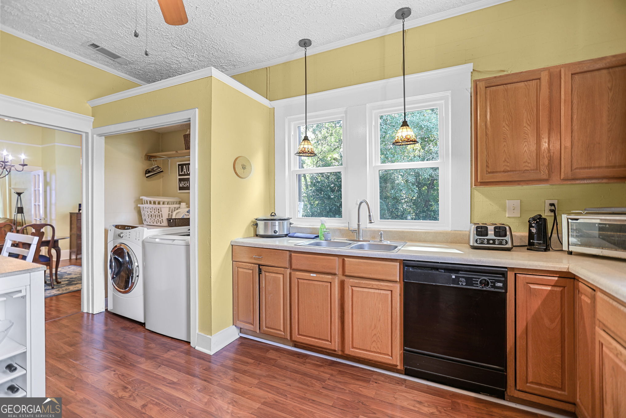 1205 Terrell Street Greenville, GA 30222 - Photo 35 of 50 a kitchen with a sink a window and stainless steel appliances