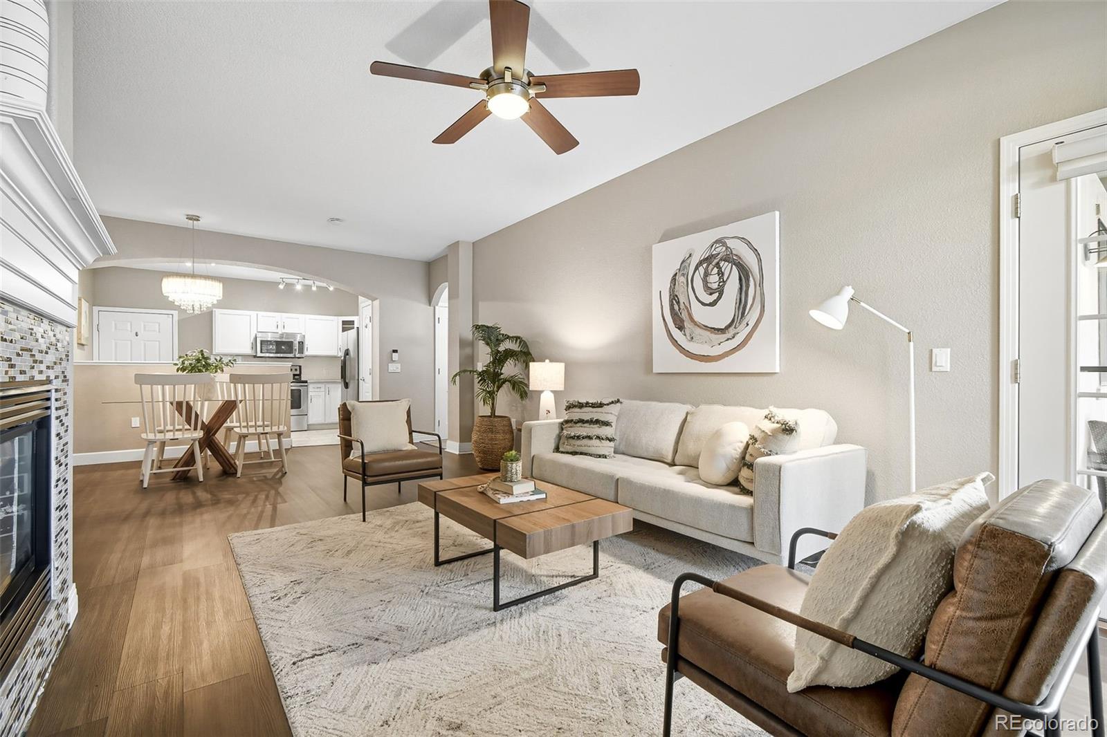 159 Quebec Street, Unit D Denver, CO 80220 - Photo 3 of 49 a living room with furniture and a fireplace
