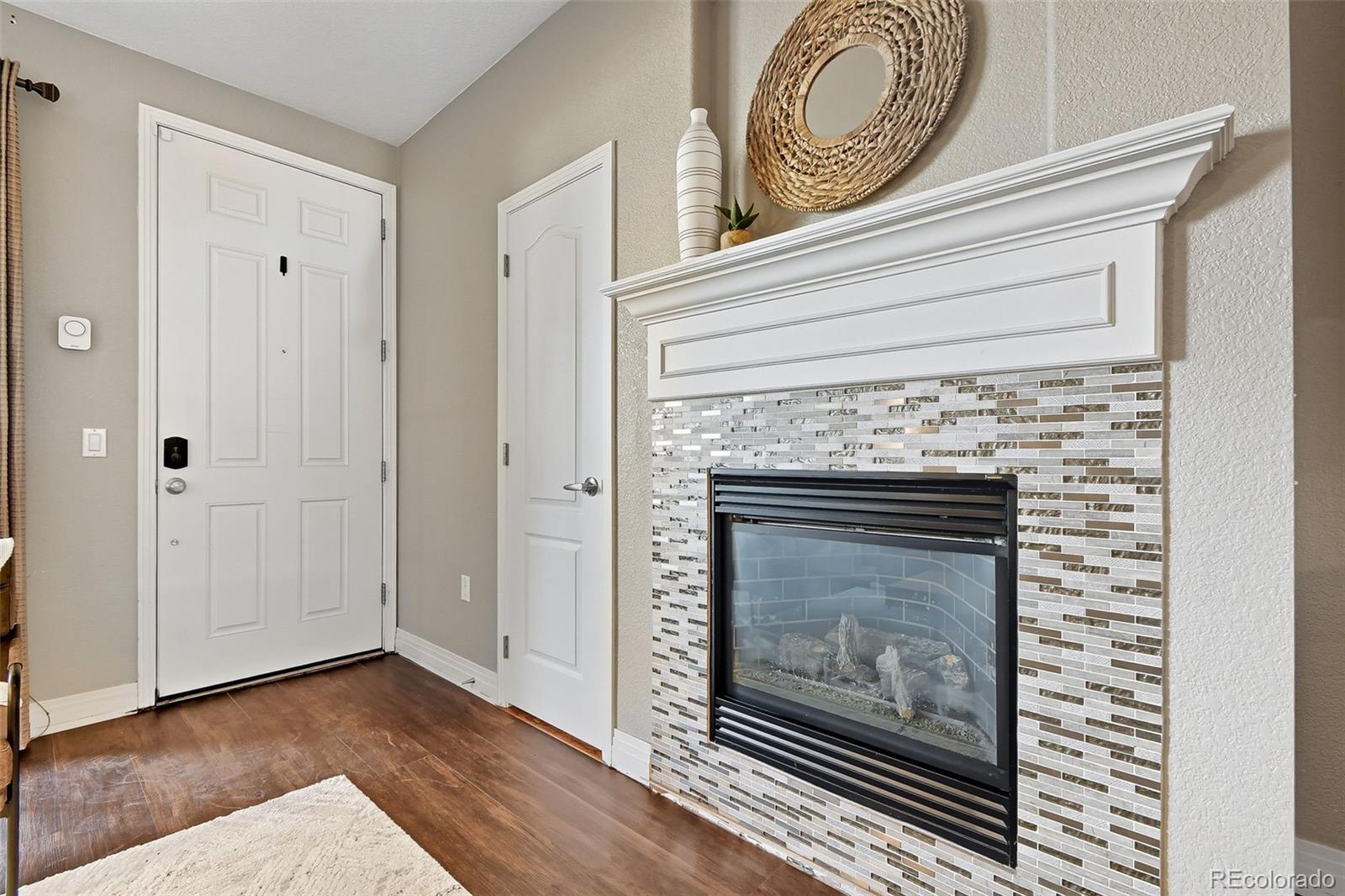 159 Quebec Street, Unit D Denver, CO 80220 - Photo 4 of 49 a view of fireplace in livingroom