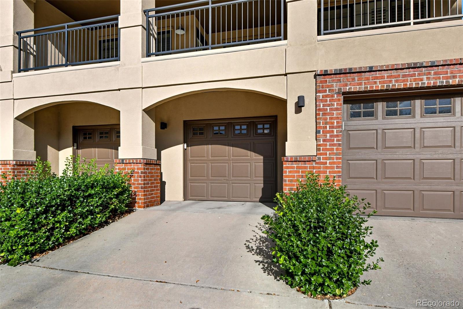 159 Quebec Street, Unit D Denver, CO 80220 - Photo 45 of 49 a front view of a house with a garage