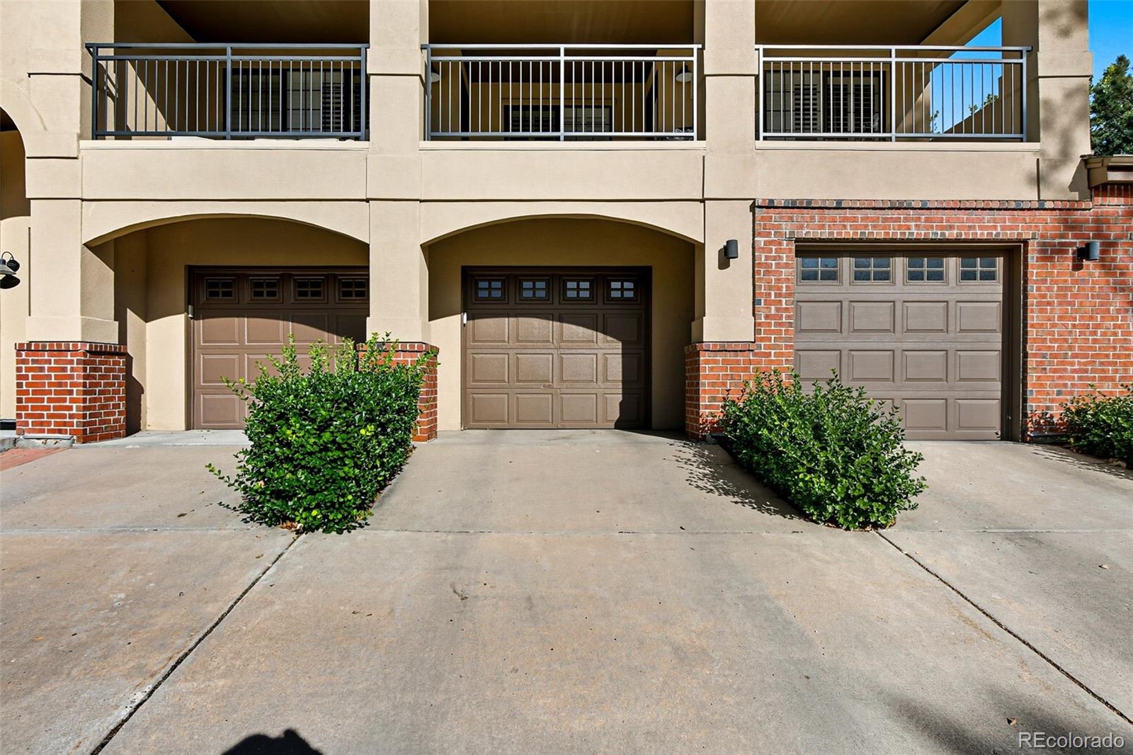 159 Quebec Street, Unit D Denver, CO 80220 - Photo 46 of 49 a front view of a house with a yard