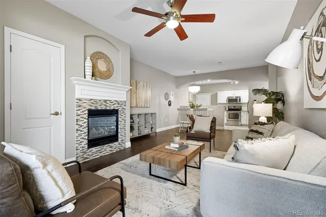 a living room with furniture and a fireplace